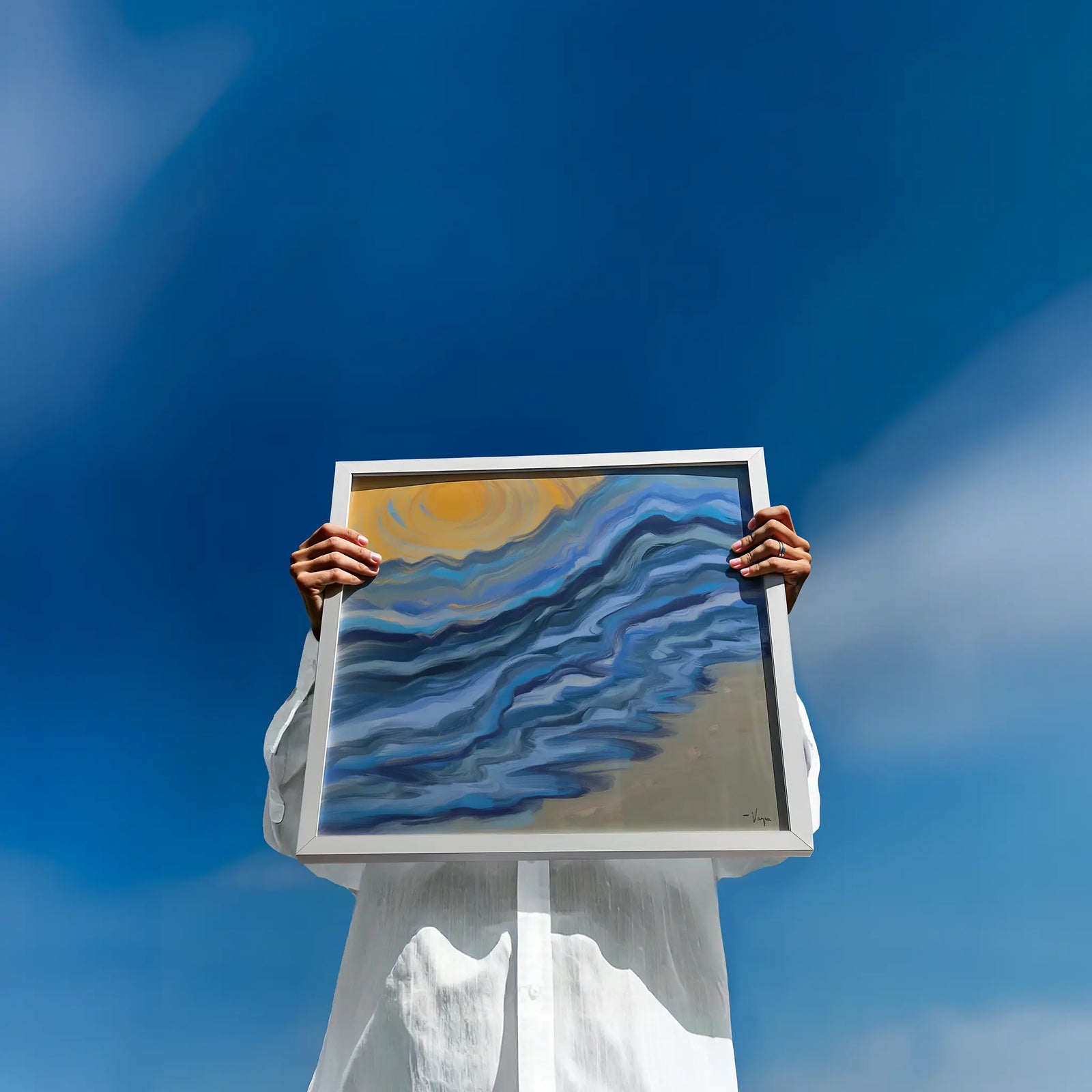 A person in a white dress holds a square framed painting against a bright blue sky. The painting depicts blue and gray wavy lines resembling water or clouds, with a yellow sun in the upper left corner.